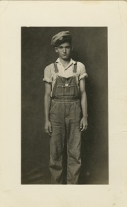 Mike Disfarmer (American, 1884 - 1959), Untitled (Young Man in Overalls and Cap), c. 1940 - 1949, Gelatin silver contact print, 4-1/2 x 2-3/8 inches, Gift of Michael Mattis and Judith Hochberg, University of New Mexico Art Museum, Albuquerque, 2015.15.14, Image Courtesy of Geistlight Photography